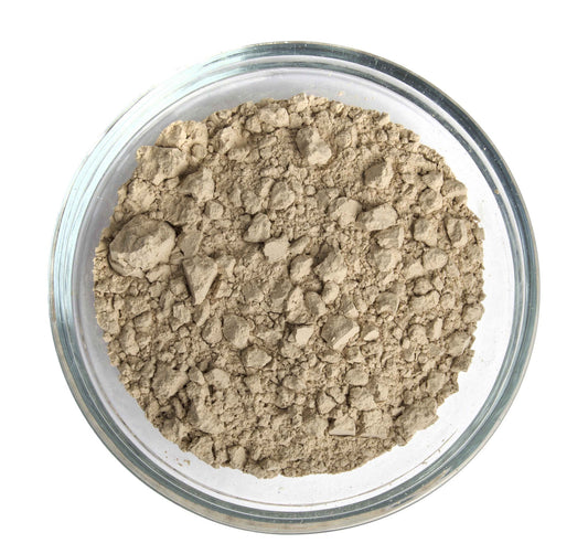 Close-up of micronized Azomite powder for organic gardening and crop yield improvement.
